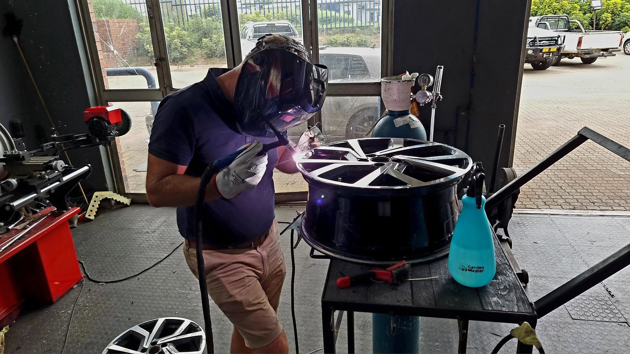 Technician working on a wheel at DMR Nelspruit